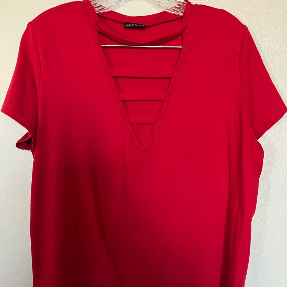 Red top, stretchy material.